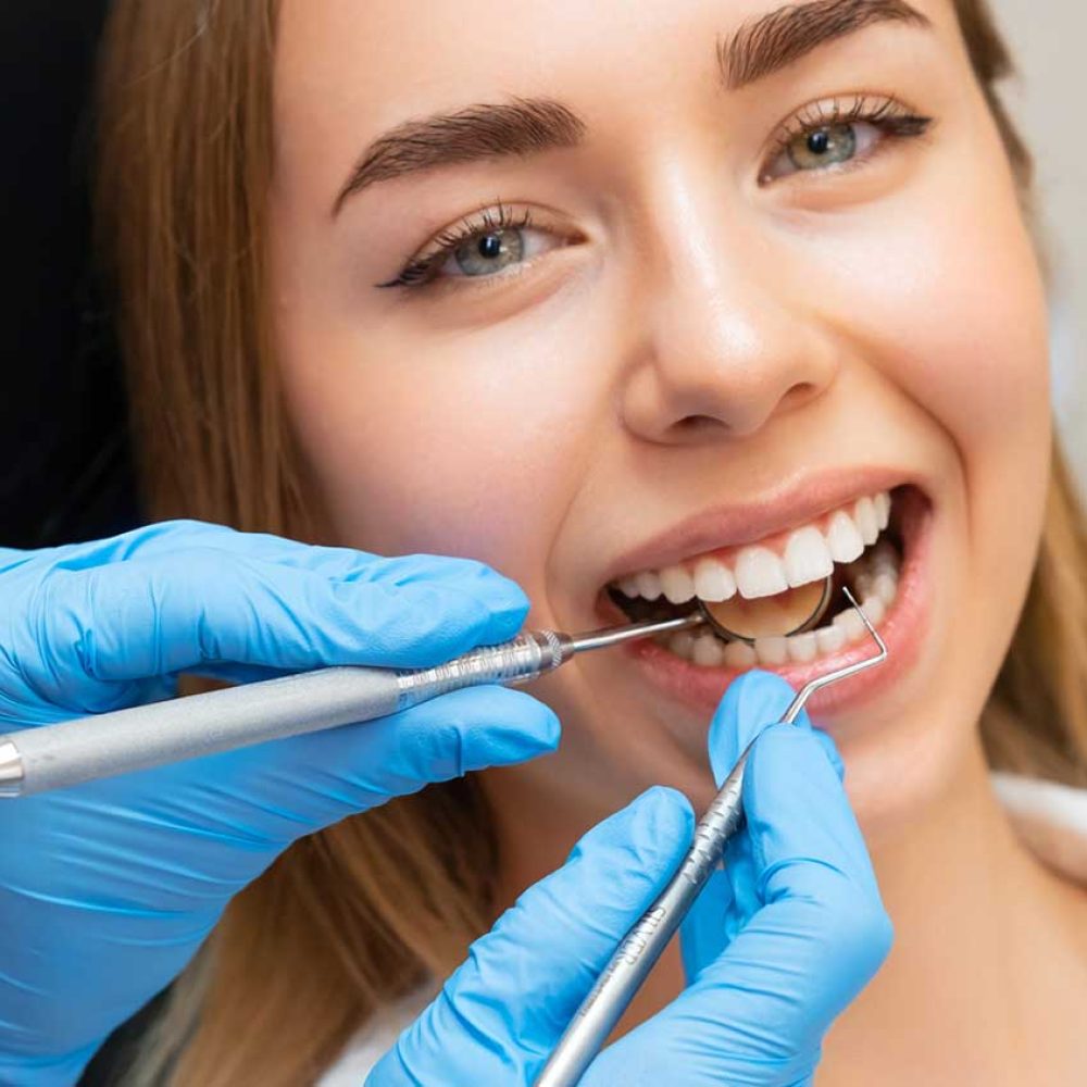 dentist-checking-patient-teeth